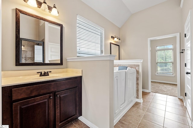 135 Adams Creek Pl, Simpsonville, SC 29681 - bathroom featuring vaulted ceiling, vanity, tile patterned flooring, baseboards, and a shower