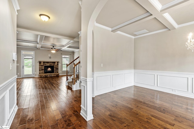 135 Adams Creek Pl, Simpsonville, SC 29681 - spare room with coffered ceiling, a brick fireplace, dark wood finished floors, beam ceiling, and ceiling fan