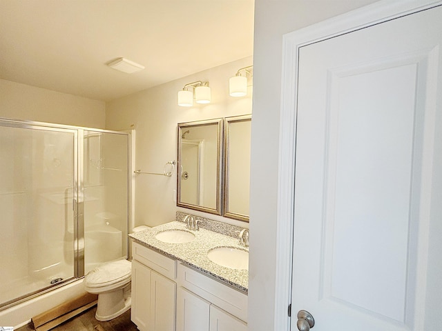 209 Islay Way, Anderson, SC 29621 - bathroom with toilet, a shower stall, double vanity, and wood finished floors