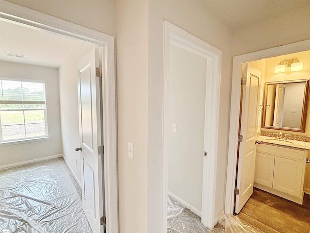 209 Islay Way, Anderson, SC 29621 - hall with a sink, baseboards, and light wood finished floors