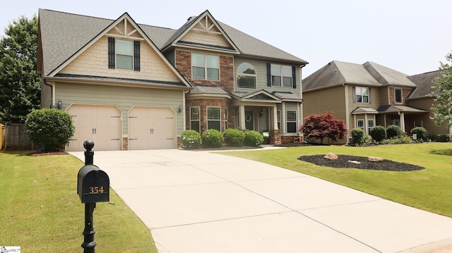 354 Harkins Bluff Dr, Greer, SC 29651 - craftsman house featuring driveway, a front lawn, stone siding, and a garage