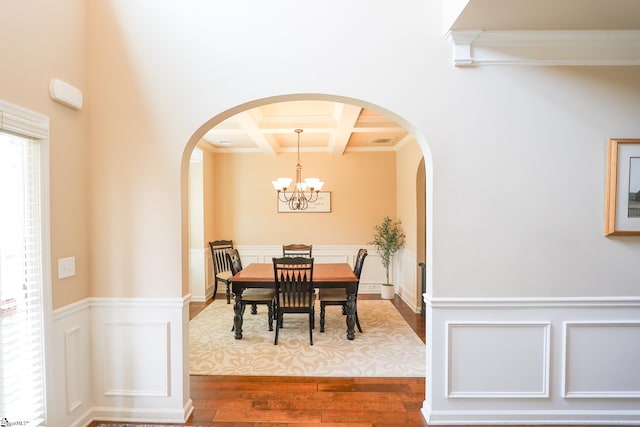 354 Harkins Bluff Dr, Greer, SC 29651 - dining area featuring coffered ceiling, crown molding, dark wood-style flooring, beamed ceiling, and arched walkways