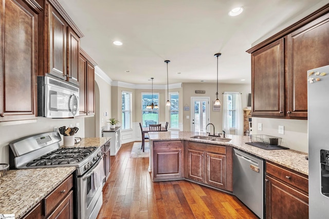 354 Harkins Bluff Dr, Greer, SC 29651 - kitchen featuring appliances with stainless steel finishes, a peninsula, dark wood finished floors, healthy amount of natural light, and recessed lighting
