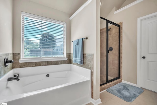 354 Harkins Bluff Dr, Greer, SC 29651 - full bathroom with healthy amount of natural light, a garden tub, a shower stall, and tile patterned flooring