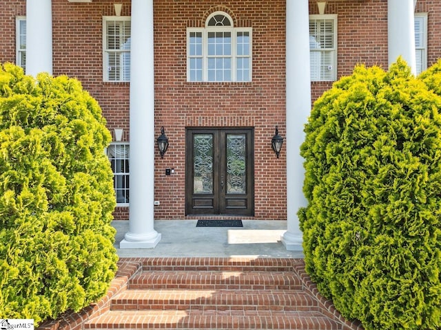 201 Corinthian Dr, Simpsonville, SC 29681 - property entrance with french doors and brick siding