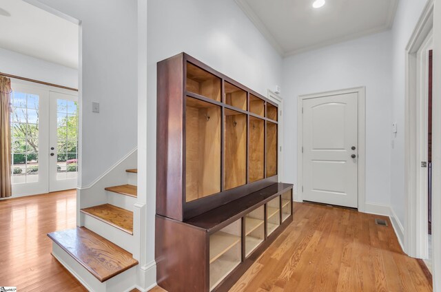 201 Corinthian Dr, Simpsonville, SC 29681 - mudroom with light wood-style floors, ornamental molding, and baseboards