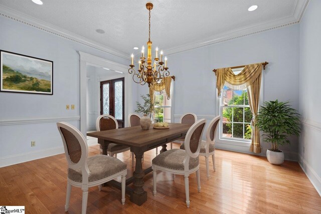 201 Corinthian Dr, Simpsonville, SC 29681 - dining area with a chandelier, light wood-style floors, crown molding, recessed lighting, and baseboards
