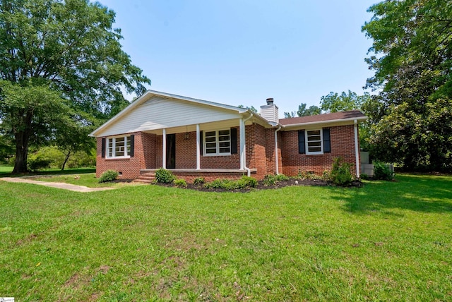 231 E Hampton Ave, Honea Path, SC 29654 - single story home featuring brick siding, a front lawn, a chimney, and crawl space