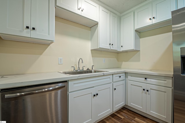 231 E Hampton Ave, Honea Path, SC 29654 - kitchen featuring stainless steel dishwasher, a sink, white cabinets, and dark wood-style floors