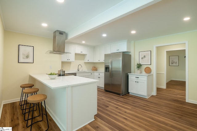 231 E Hampton Ave, Honea Path, SC 29654 - kitchen featuring stainless steel fridge, island exhaust hood, a sink, a peninsula, and white cabinetry