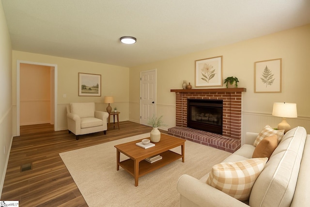 231 E Hampton Ave, Honea Path, SC 29654 - living room featuring wood finished floors, a fireplace, and a wainscoted wall