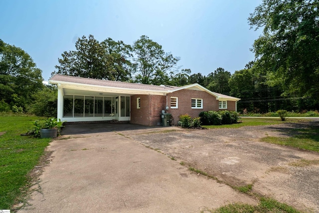 231 E Hampton Ave, Honea Path, SC 29654 - ranch-style home featuring asphalt driveway, brick siding, and a front yard