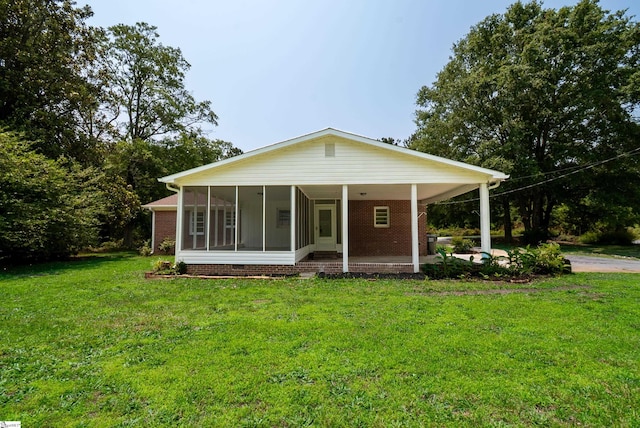 231 E Hampton Ave, Honea Path, SC 29654 - view of front of house with a front yard and a sunroom