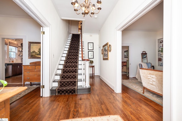 102 Todd Ave, Laurens, SC 29360 - entrance foyer with wood finished floors, stairway, a chandelier, and ornamental molding