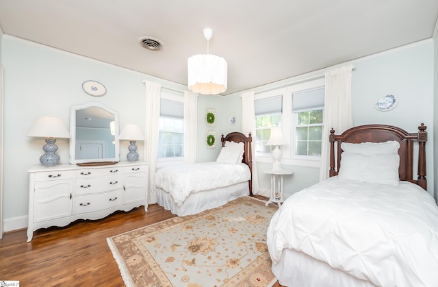 102 Todd Ave, Laurens, SC 29360 - bedroom with multiple windows and wood finished floors