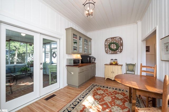 102 Todd Ave, Laurens, SC 29360 - dining area featuring light wood-type flooring, crown molding, and french doors