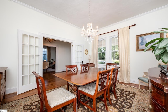 102 Todd Ave, Laurens, SC 29360 - dining area with a chandelier, ornamental molding, wood finished floors, plenty of natural light, and baseboards