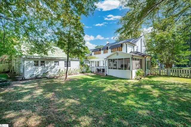 102 Todd Ave, Laurens, SC 29360 - rear view of house featuring a sunroom and a chimney