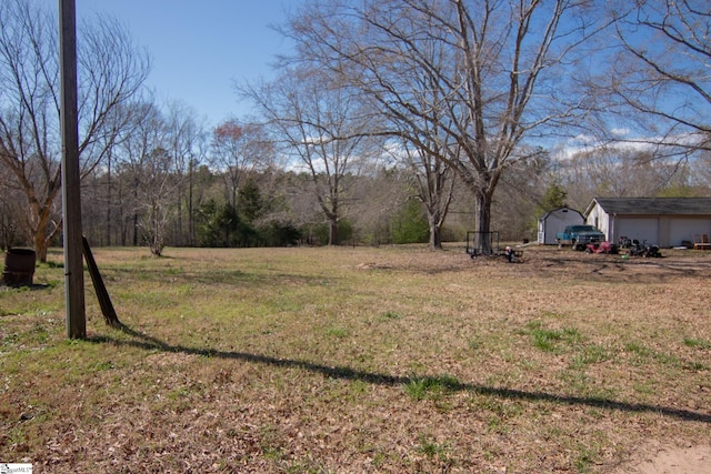 202 Centerpointe Rd, Belton, SC 29627 - view of grassy yard with an outbuilding and a garage