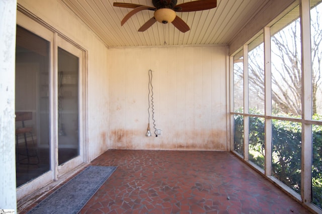 202 Centerpointe Rd, Belton, SC 29627 - unfurnished sunroom featuring stone flooring, a ceiling fan, wood ceiling, and wooden walls