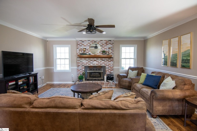 202 Centerpointe Rd, Belton, SC 29627 - living room with wood finished floors, a ceiling fan, baseboards, a fireplace, and ornamental molding