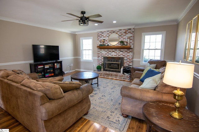 202 Centerpointe Rd, Belton, SC 29627 - living area featuring wood finished floors, ceiling fan, crown molding, a brick fireplace, and baseboards