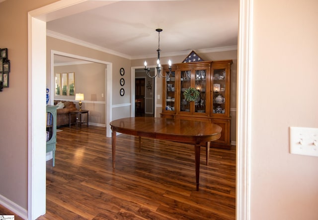 202 Centerpointe Rd, Belton, SC 29627 - dining space with a chandelier, dark wood finished floors, crown molding, and baseboards
