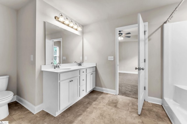 203 Rosewood Cir, Duncan, SC 29334 - bathroom featuring toilet, double vanity, ceiling fan, and baseboards