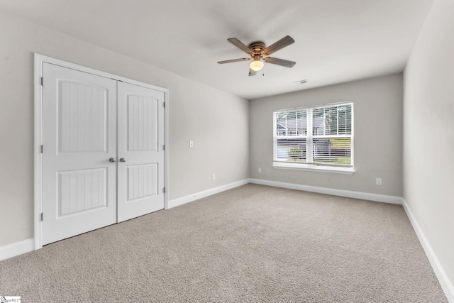 203 Rosewood Cir, Duncan, SC 29334 - unfurnished bedroom with carpet flooring, baseboards, a closet, and ceiling fan