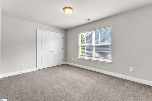 203 Rosewood Cir, Duncan, SC 29334 - unfurnished bedroom with baseboards, carpet flooring, and a closet