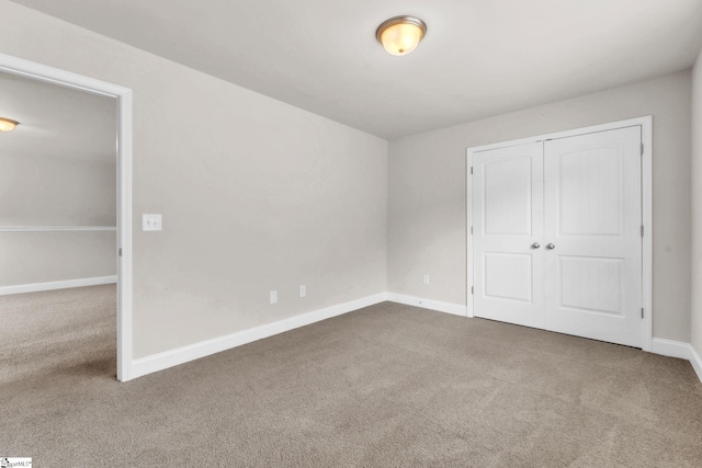 203 Rosewood Cir, Duncan, SC 29334 - unfurnished bedroom featuring carpet floors, baseboards, and a closet