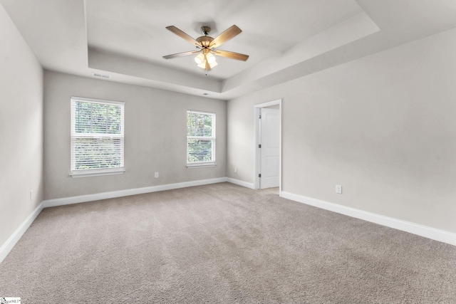 203 Rosewood Cir, Duncan, SC 29334 - empty room featuring a raised ceiling, baseboards, ceiling fan, and carpet