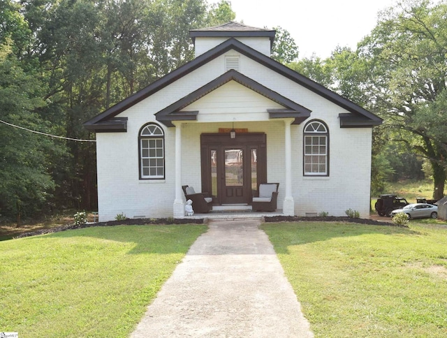 127 Eastview Rd, Pelzer, SC 29669 - view of front of property featuring brick siding, a porch, and a front yard
