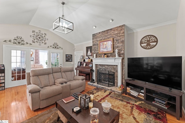 105 Garden View Ct, Piedmont, SC 29673 - living area featuring light wood finished floors, a chandelier, a fireplace, crown molding, and vaulted ceiling
