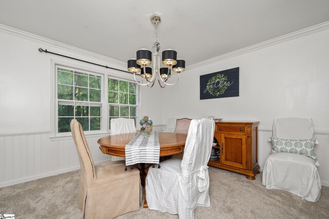 101 Shagbark Cir, Simpsonville, SC 29680 - dining space featuring a chandelier, light carpet, crown molding, and wainscoting