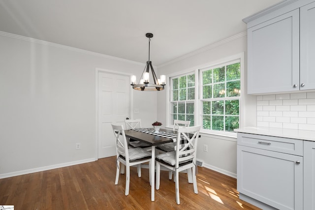 101 Shagbark Cir, Simpsonville, SC 29680 - dining space featuring a chandelier, wood finished floors, baseboards, and crown molding