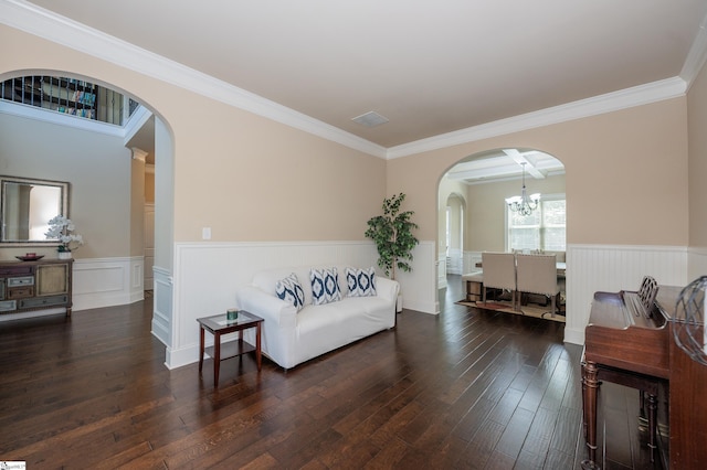 37 Wild Eve Way, Greer, SC 29650 - sitting room featuring arched walkways, a wainscoted wall, dark wood-type flooring, crown molding, and a chandelier