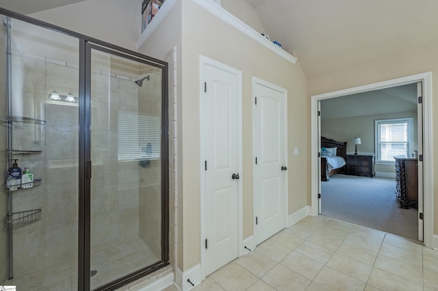 37 Wild Eve Way, Greer, SC 29650 - bathroom with connected bathroom, lofted ceiling, tile patterned flooring, a stall shower, and baseboards