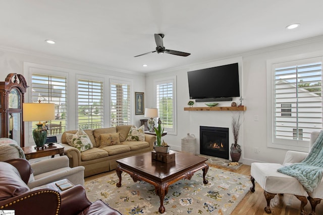 208 Deer Thicket Way, Taylors, SC 29687 - living area featuring ceiling fan, a glass covered fireplace, ornamental molding, light wood-style floors, and recessed lighting