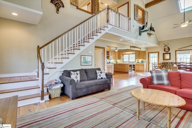 2164 Loncolnton Hwy, Elberton, GA 30635 - living area with light wood-type flooring, stairs, a high ceiling, and ceiling fan
