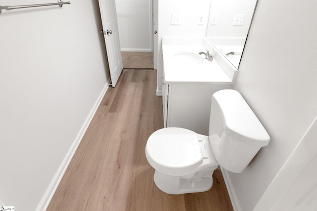 4 Dade Ct, Taylors, SC 29687 - half bath featuring wood finished floors, vanity, toilet, and baseboards