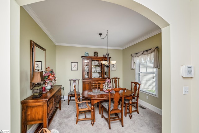 225 Chickadee Trl Unit B, Easley, SC 29642 - dining space featuring crown molding, arched walkways, baseboards, and light colored carpet