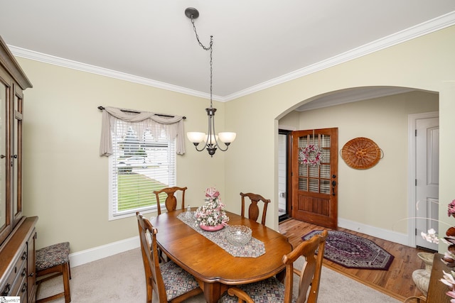225 Chickadee Trl Unit B, Easley, SC 29642 - dining area featuring arched walkways, ornamental molding, baseboards, and a chandelier
