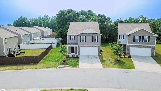 1305 Ledsham Ct, Greer, SC 29651 - view of front facade featuring stone siding, an attached garage, and driveway
