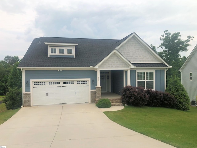 209 Claridge Way, Greer, SC 29651 - craftsman-style house featuring a front yard, concrete driveway, a porch, and central air condition unit