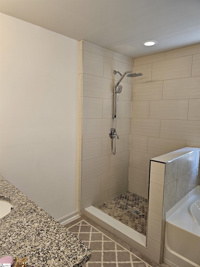 700 Citrine Way, Duncan, SC 29334 - bathroom featuring tiled shower, a bath, recessed lighting, baseboards, and vanity