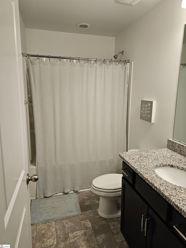 700 Citrine Way, Duncan, SC 29334 - bathroom with vanity, stone finish flooring, toilet, and shower / tub combo with curtain