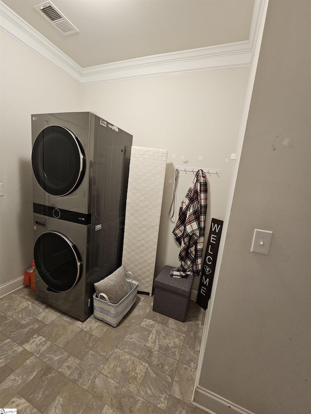 700 Citrine Way, Duncan, SC 29334 - washroom with stacked washer / drying machine, ornamental molding, stone finish flooring, and baseboards