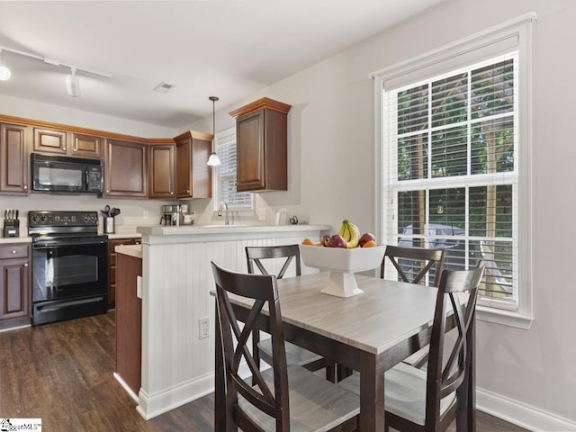 125 Saxon Falls Ct, Greenville, SC 29607 - kitchen featuring black appliances, dark wood finished floors, light countertops, and plenty of natural light