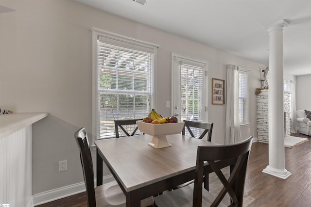 125 Saxon Falls Ct, Greenville, SC 29607 - dining room featuring ornate columns, dark wood-type flooring, and baseboards